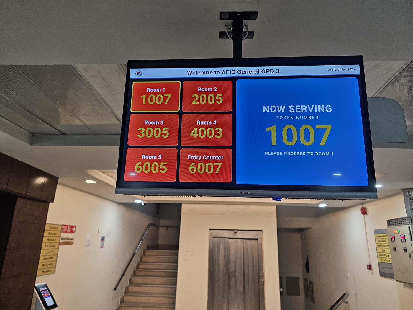 H-TECH lobby display at AFIO General OPD 3 — Now Serving